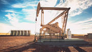 Hydraulic fracking machine amidst sunny background