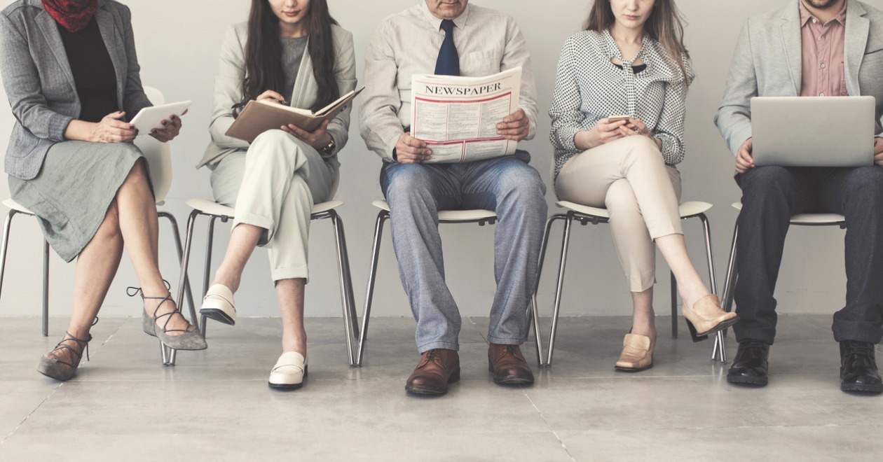 Group of people reading the latest news stories