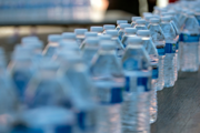 Plastic single-use water bottles lined up