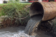 Sewage water flowing out of pipe