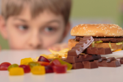 Kid staring at junk food