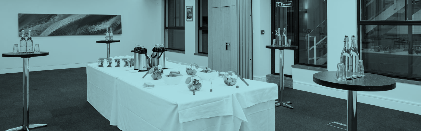 A conference room table set with refreshments