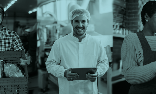 Three people undertaking food safety tasks